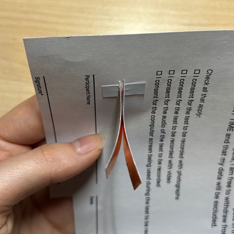 I folded the tails of the tape to the back side so that from the front, you can only see the tape.